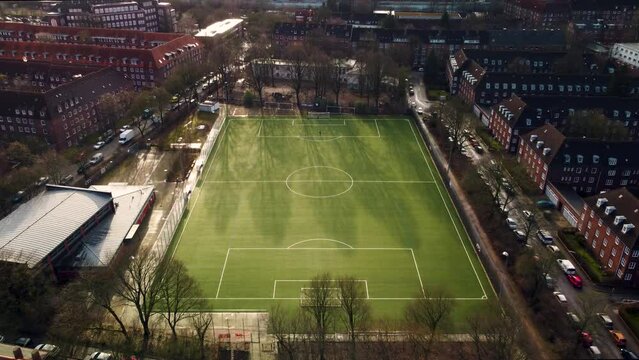Drone Shot of Urban Soccer Field with Players in Hamburg Dulsberg in Winter