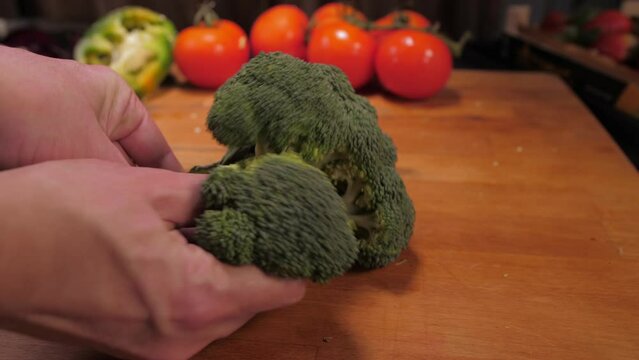 chef hands cutting broccoli slow motion 4k