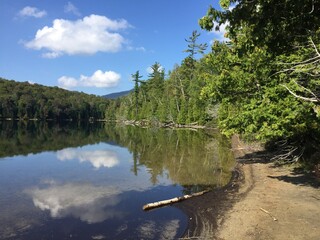 reflections of clouds in lake
