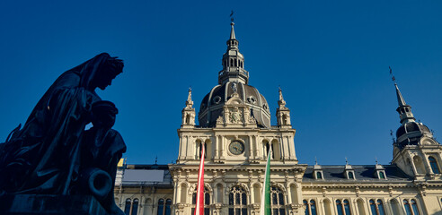 City Hall in Graz with statue on the main square during the day with blue sky