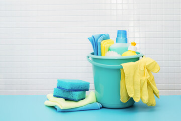 Cleaners and detergents in bucket, accessories for cleaning various surfaces and rooms blue...