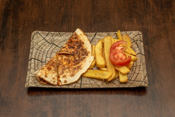 Mexican quesadilla menu with homemade chips and sliced tomato