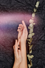 Beauty hands woman with flowers on background. Skin care cosmetics