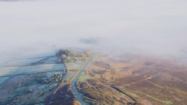 Lealhome drone flight from moor top moving over mist shrouded valley Autumn Winter - DJI Inspire 2