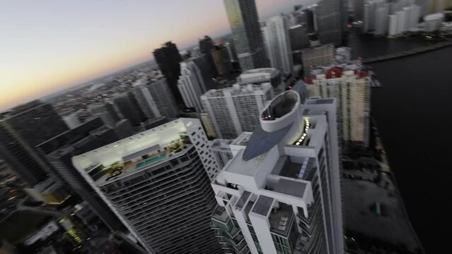 FPV drone shot over the skyline of Brickell bay, sunrise in Miami- POV aerial view