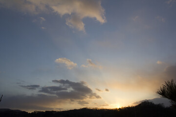 Fototapeta na wymiar cloud and vanilla sky background with dark mountain silhouette