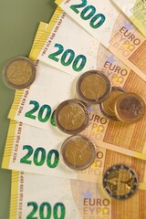 Money and finance.Euro currency. euro banknotes bundle on a green background..Finance and savings