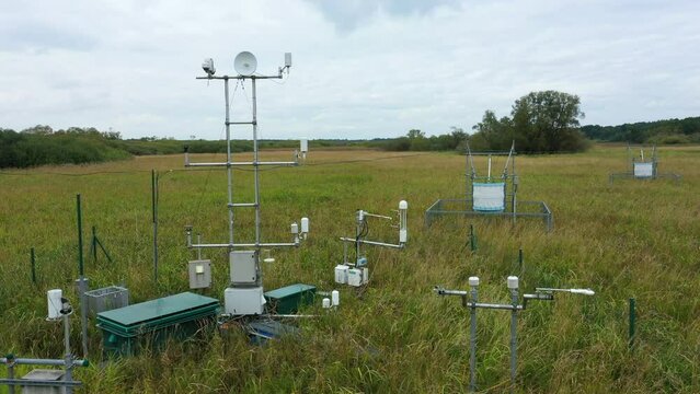 Station science research for studying wetlands meadows, drone aerial video shot ecosystem weather station swamp willows cycle carbon flux eddy covariance methane research physiological photosynthesis