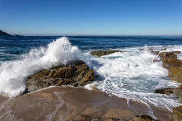 A view on the Pacific ocean with sky and waves
