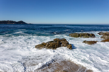 A view on the Pacific ocean with sky and waves