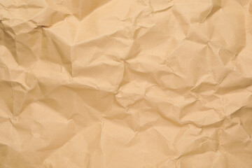 Texture of brown crumpled paper as background, closeup