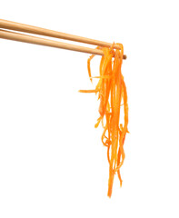 Chopsticks with delicious Korean carrot salad on white background