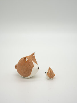 Lovely clay dog on a white background