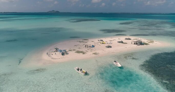 kite surfing camp. People rigging lines and kite for kitesurfing on Caribbean island. Sport water Saki saki Los Roques