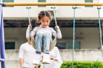Portrait of enjoy happy love asian family father and mother with little asian girl smiling playing...