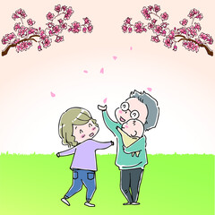 桜を見上げて楽しむ家族