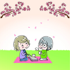 桜の花の下でお弁当を食べる女性たち