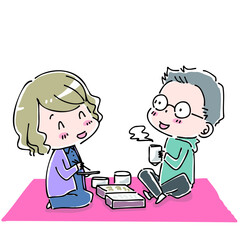 ピクニックシートを広げてお弁当を食べる男女