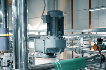 Powerful electric motors of vibrating mills in workshop