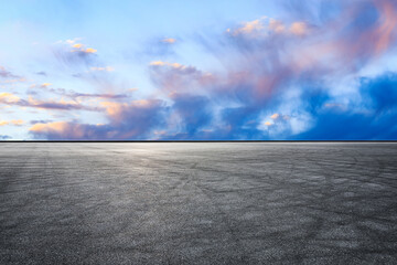 Empty asphalt road and colorful sky clouds at sunrise