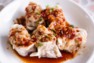 Dumpling close up on white plate background. snack food in restaurant. traditional food of Chinese and asian Thailand.