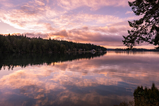 Vibrantly colorful sunrise reflections on Puget Sound, Washington, Pacific Northwest
