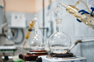 Flask with boiling alcohol at distillation in laboratory