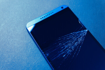Broken smartphone screen, cracked glass
