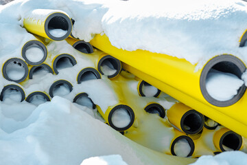 Natural yellow gas pipes under the snow.