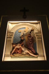 Fototapeta premium Stations of the Cross: The body of Jesus is taken down from the cross