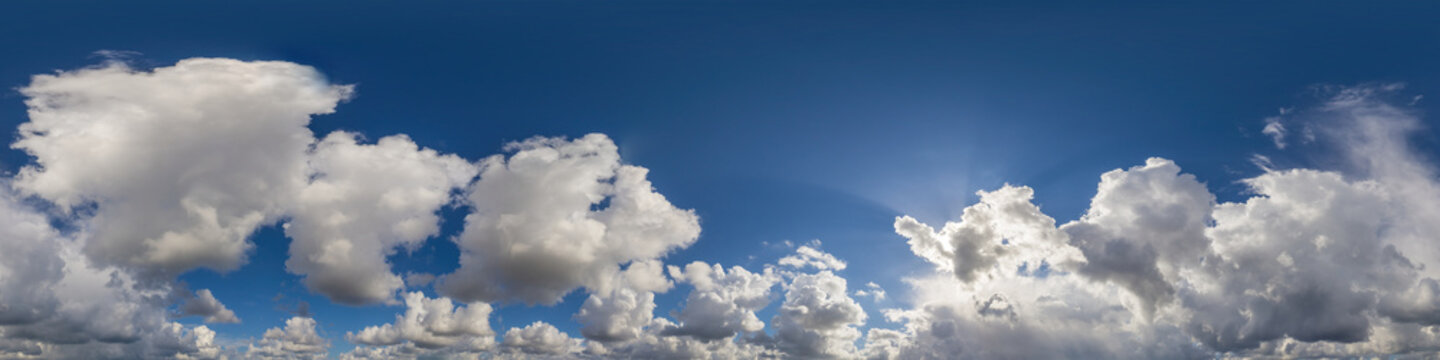 Blue sky panorama with puffy Cumulus clouds. Seamless hdr pano in spherical equirectangular format. Sky dome or zenith for 3D visualization, game and sky replacement for aerial drone 360 panoramas.