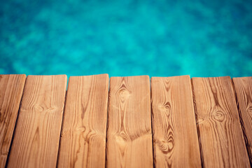 Wooden background against blurred water