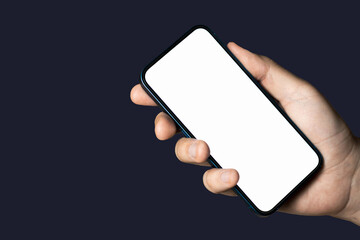 Hand holding a phone with empty white screen on black background