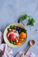 Healthy festive snacks and desserts. Mixed Fruits Muesli Bowl with Olives Cheese and Crackers. Great with health benefits, ideal for between meals snack and breakfast.