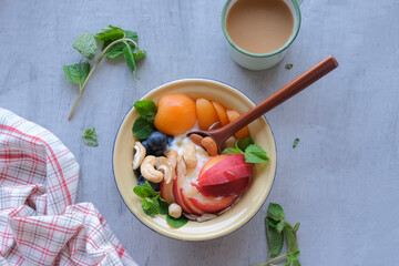 Healthy festive snacks and desserts. Mixed Fruits Muesli Bowl with Olives Cheese and Crackers. Great with health benefits, ideal for between meals snack and breakfast.
