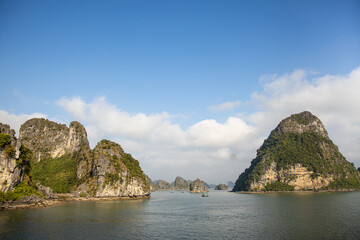 Fototapeta na wymiar Cruising through the rocky outcrops of Halong Bay in Vietnam