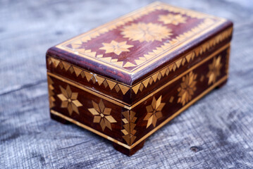 Brown wooden box with a pattern