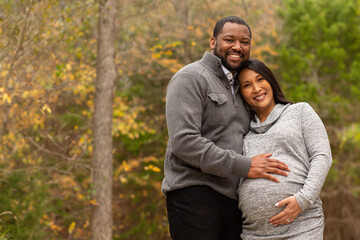 Portrait of a mixed race couple who are expecting parents