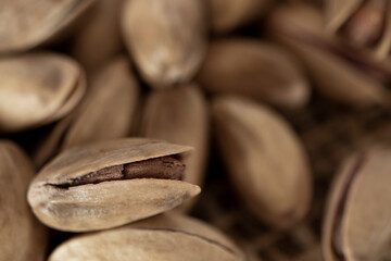 shelled pine nuts on a straw mat. close-up.