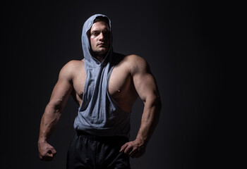 Fototapeta premium Brutal man, handsome serious male model. Strong muscular male body, muscles guy.
