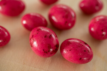 round marshmallows in red color. like eggs. candies. 