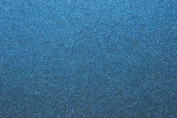 Dark blue glitter effect paper texture as background