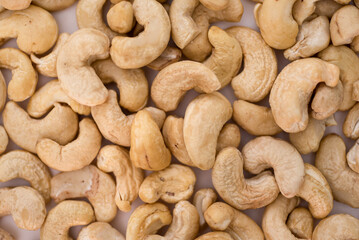 Tasty cashew nuts as background, top view