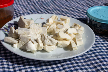 several kinds of cheese on white plate 