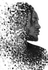 A profile portrait of a man combined with black ink splashes. Paintography.