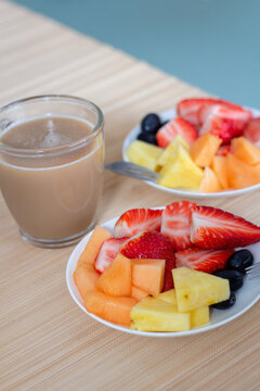 Colorful, ripe, delicious fruits on table and Coffee, breakfast, morning