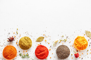 colorful spices and seasonings on a white background