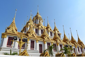 Fototapeta premium Loha Prasat Wat Ratchanatdaram with the characteristics of Thai architecture and architecture as a 3-story castle with 37 golden spires.