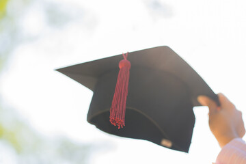 Graduation, Blurred image of student hold hats in hand during commencement success graduates of the university