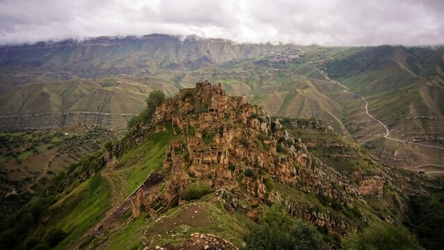 The ghost town of Gamsutl in Dagestan. Stone crumbling houses on a mountainside.